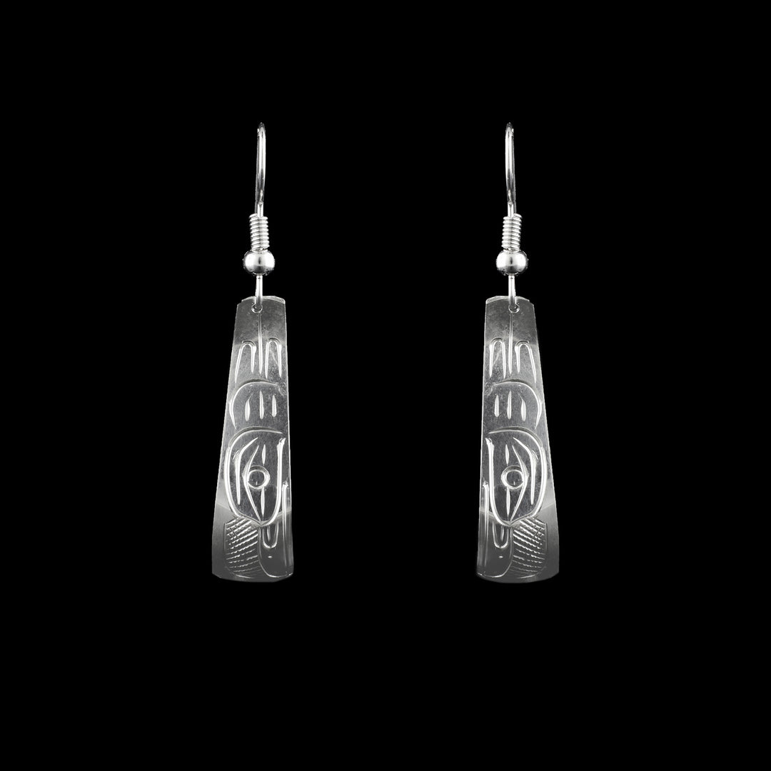 These Sterling Silver Dangle Earrings are hand carved with the legend of the raven. 