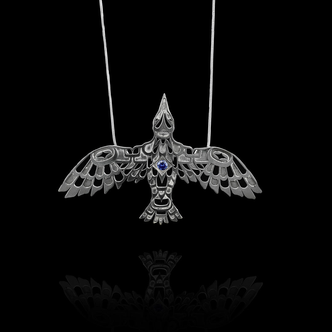 Sterling Silver Raven Pendant With A Blue Zirconia