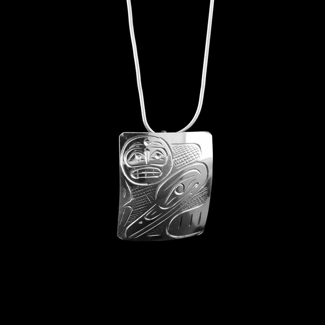 Hand carved in sterling silver the Indigenous legends Raven and Moon are carefully crafted onto the pendant surface. Pendant