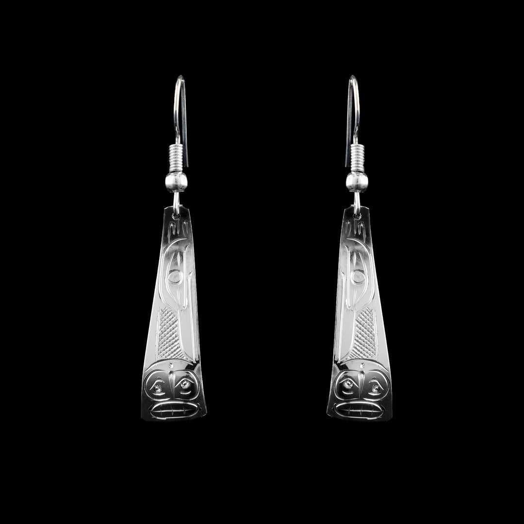 These sterling silver Raven and Moon triangle earrings are hand carved with the legend of the Raven and the Moon hand-carved into the surface. 