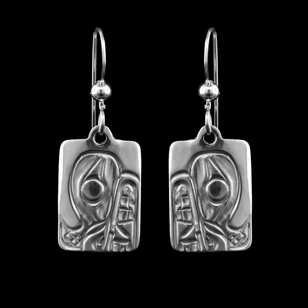 These Silver Bear Earrings are rectangular pendant fish hook earrings are engraved with the bear, the bear's eye is the central focus of the earrings.