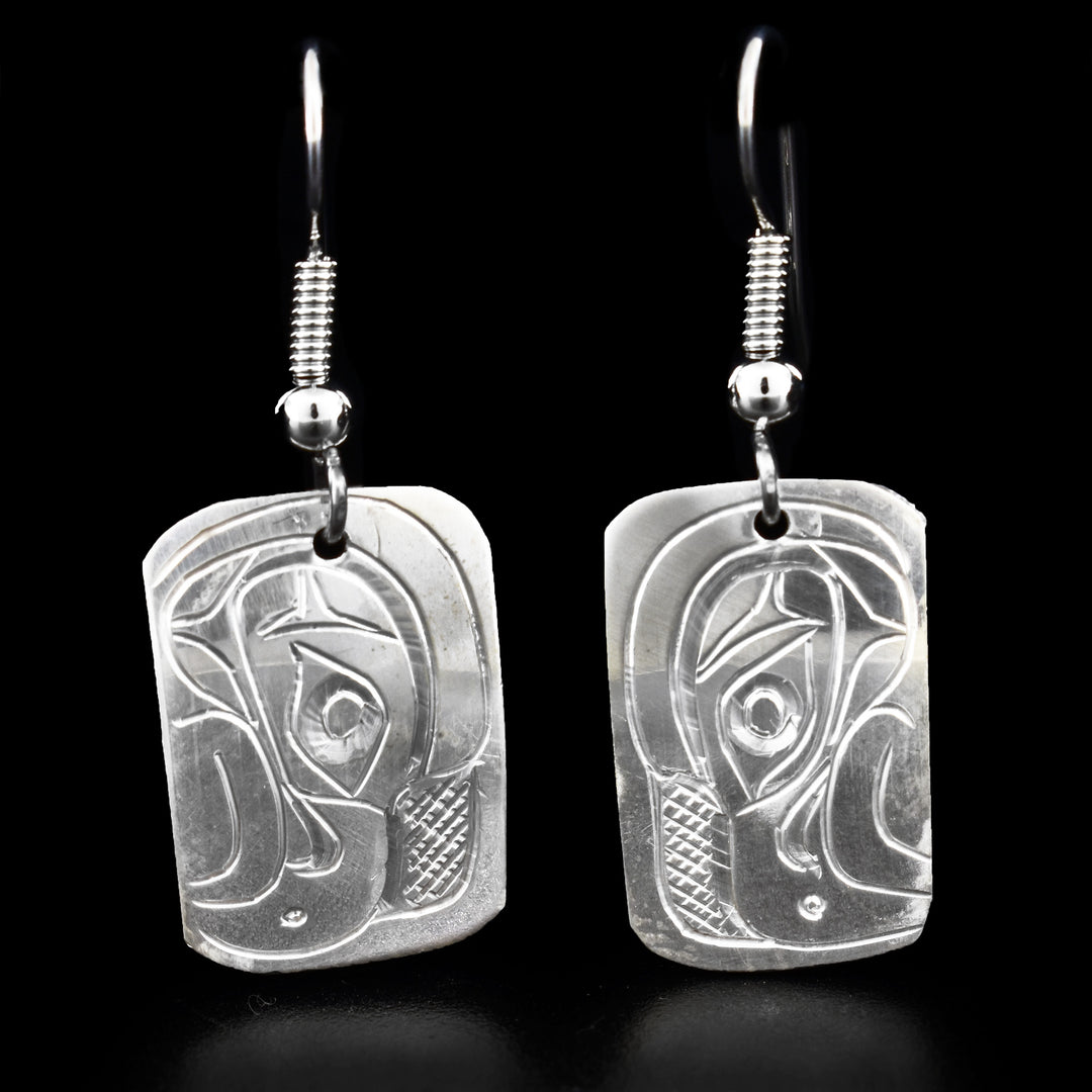 These dangling Eagle earrings are made from sterling silver and has small, rectangular hangs. There are depictions of the Eagle carved into the surface of the hangs.