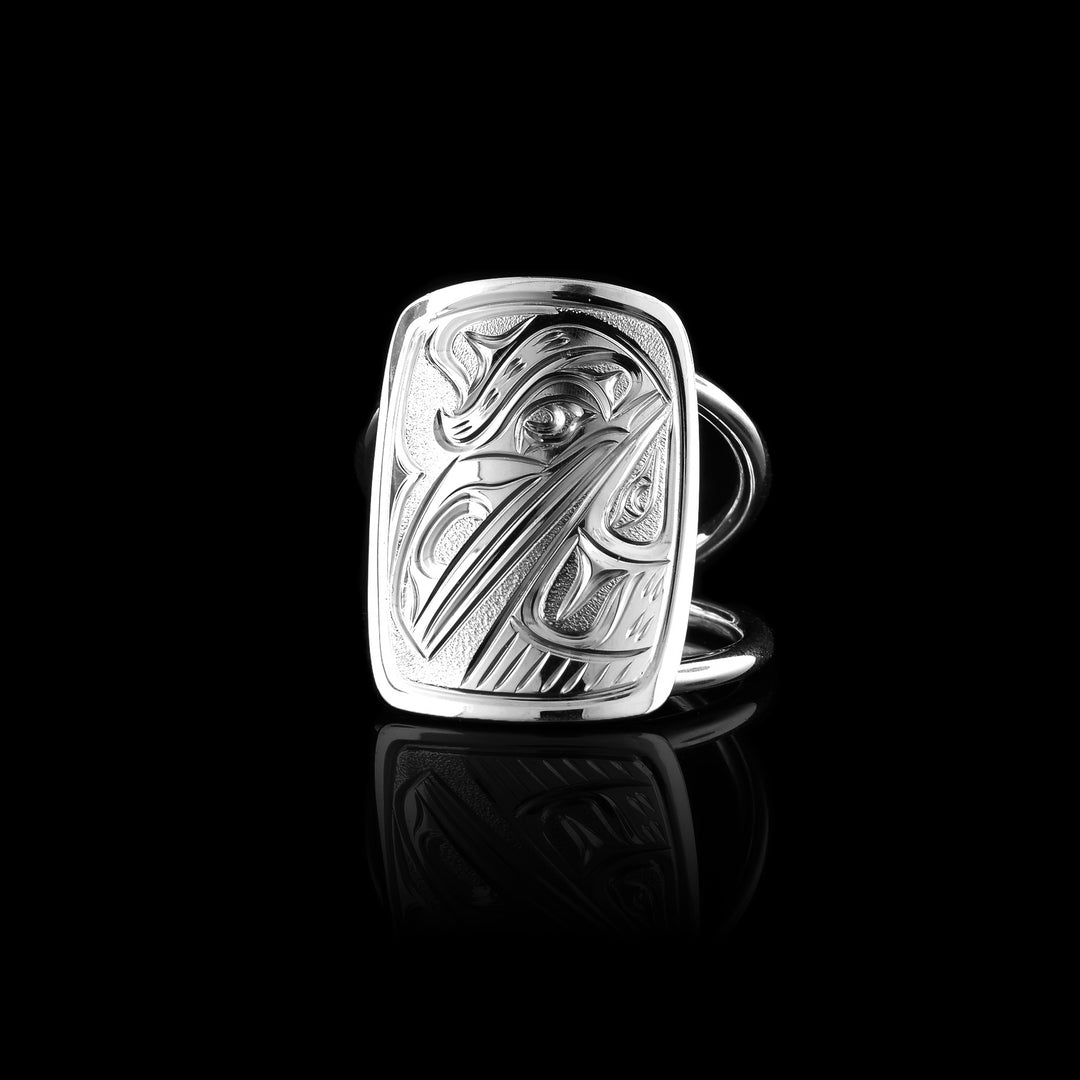 this sterling silver Raven ring hand-carved by Joe Descoteaux. Featuring a unique rectangular surface and the intricate legend of the Raven.