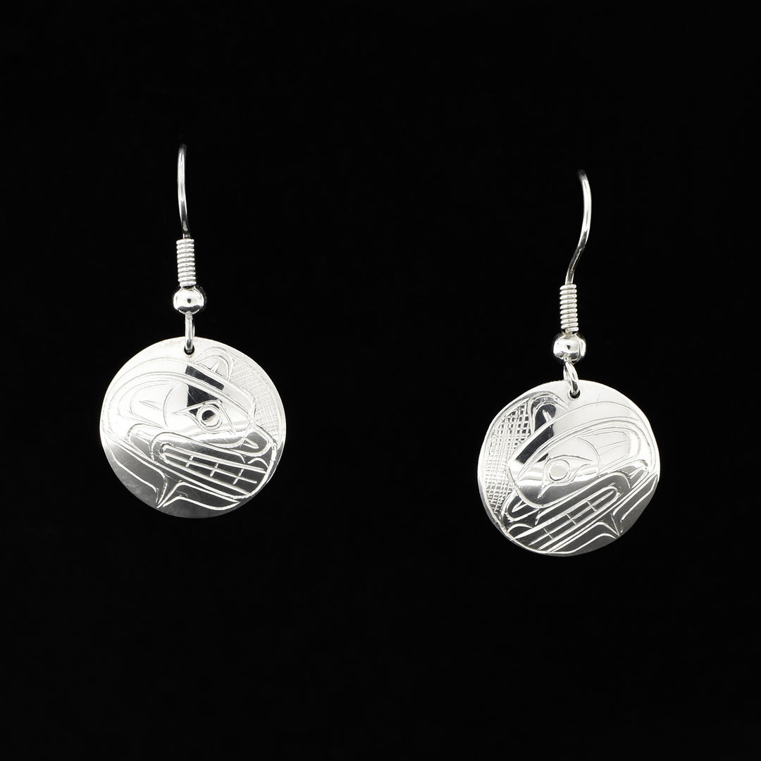 Each earring features a side-view of a bear’s head with teeth showing. Bear design made of lines and ovoids, background done in cross-hatching. Each earring measures 1.44" x 0.69" including hook.