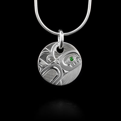 This Sterling Silver Round Orca Pendant with Tsavorite is hand carved by artist, Hollie Bartlett. This silver pendant shows the orca carved in sterling silver with a tsavorite set in the eye.

The pendant measures approximately .75″ (2.3cm) wide by 1″(2.54cm) long.

The chain is not included.



The Orca Legend Represents: LONGEVITY, PROTECTION, FAMILY