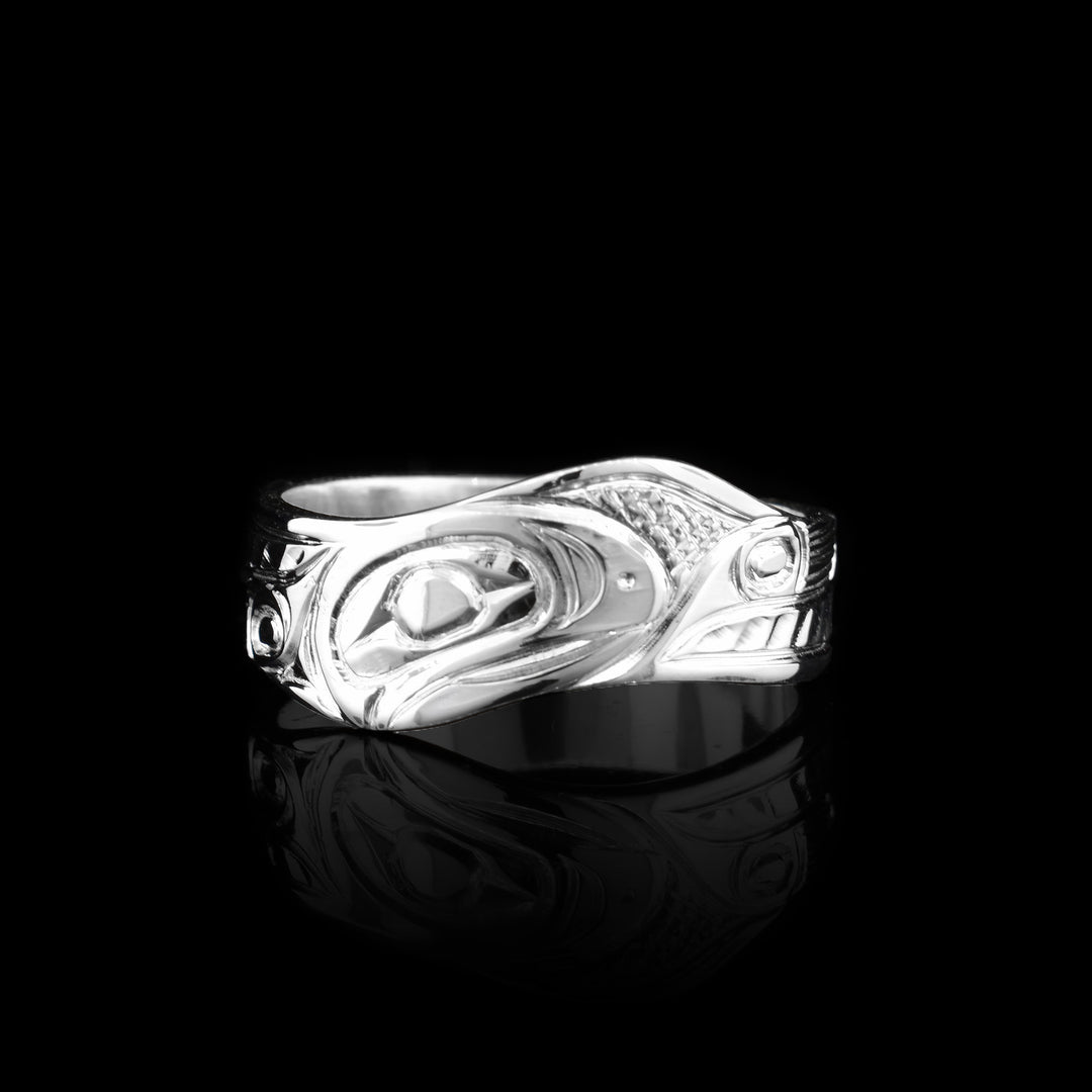 This sterling silver wavy band ring has been hand carved with the legend of the salmon.
