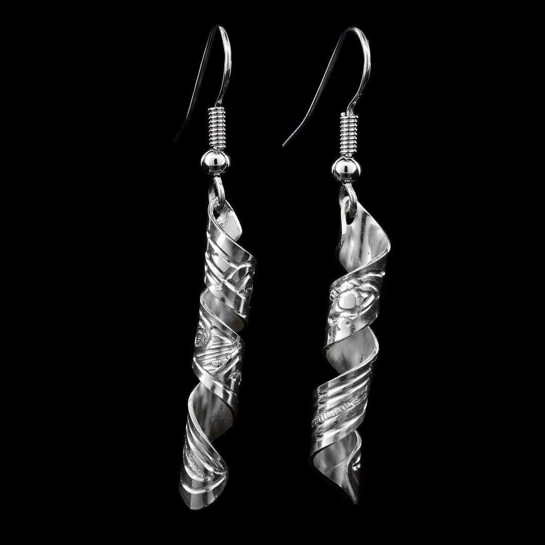 Sterling Silver Spiral Hummingbird earrings by Gilbert Pat. Each earring is in the shape of a spiral and on the earrings are hand-carved hummingbirds. The artist has also hand-carved intricate designs representing the hummingbird's feathers.