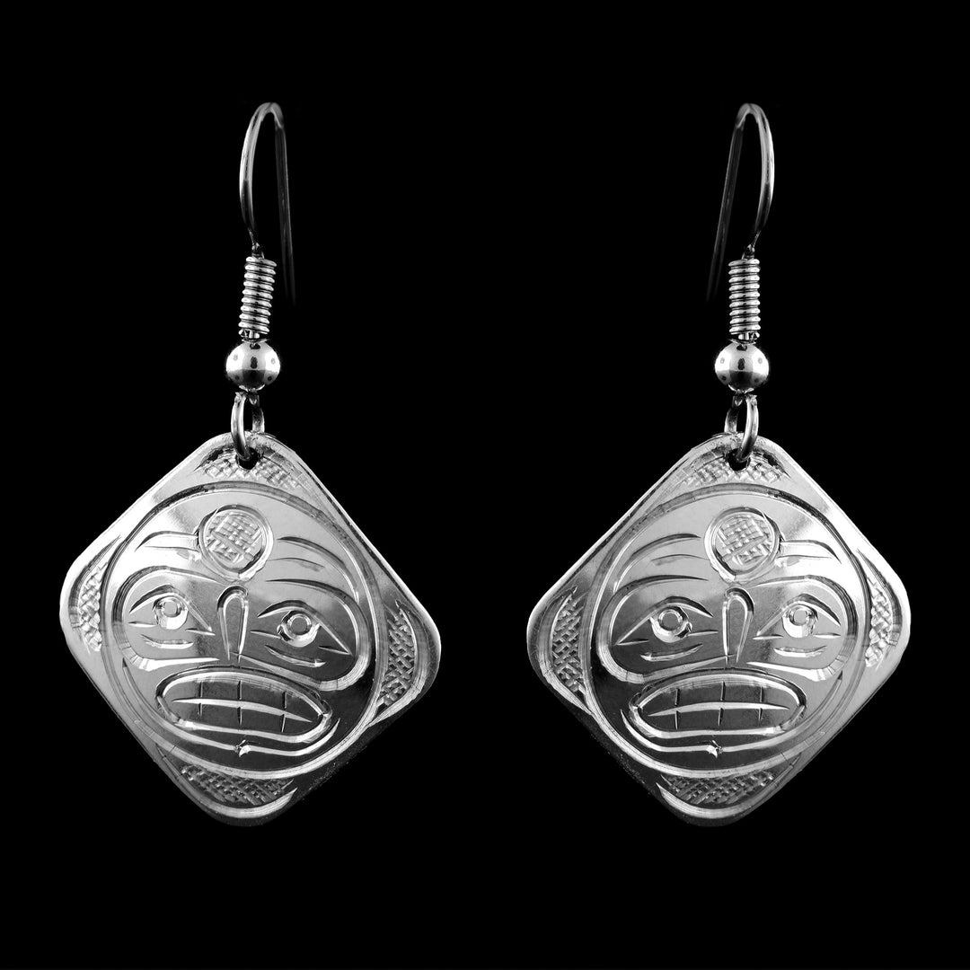 Shop hand-carved Moon earrings by Coast Salish artist Graham Henry. Exquisite sterling silver square studs featuring the legendary Moon design