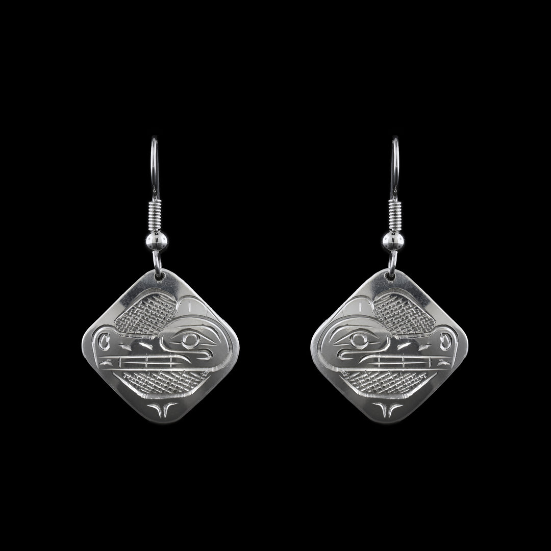 These dangle earrings are made from Sterling Silver shaped as dangle Squares with the legend of the Wolf carved on the surface.