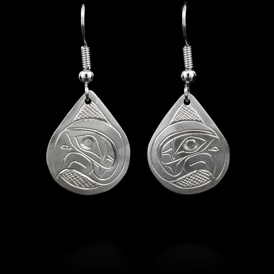 These dangling Eagle earrings are made from sterling silver and have small, teardrop shaped hangs. There are depictions of the Eagle carved into the surface of the hangs.