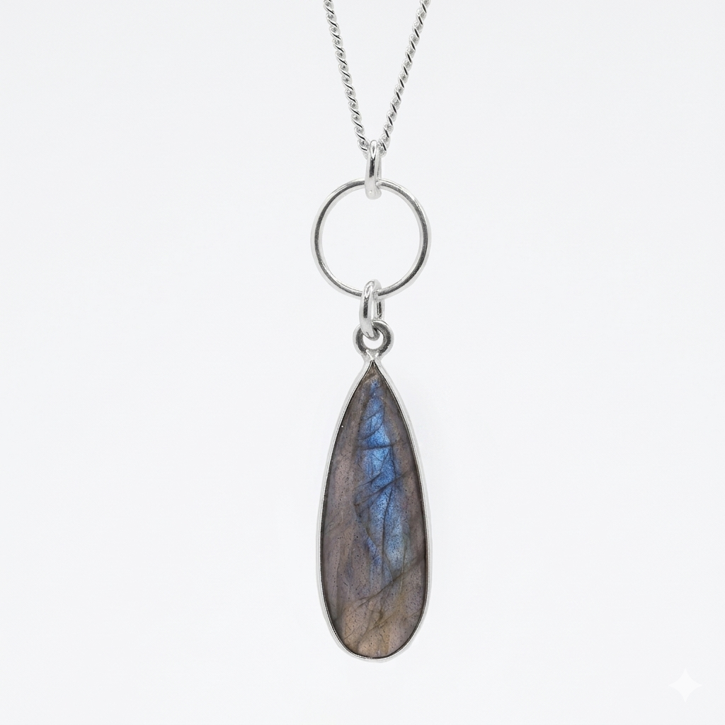 Beautifully designed by Elizabeth Burry. This exquisite sterling silver necklace features a teardrop Labradorite gemstone set in a clean, minimalist bezel.