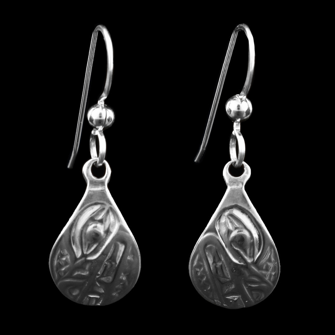 These sterling silver teardrop Wolf Earrings. Each earring features a wolf that is beautifully detailed within the silver teardrop.