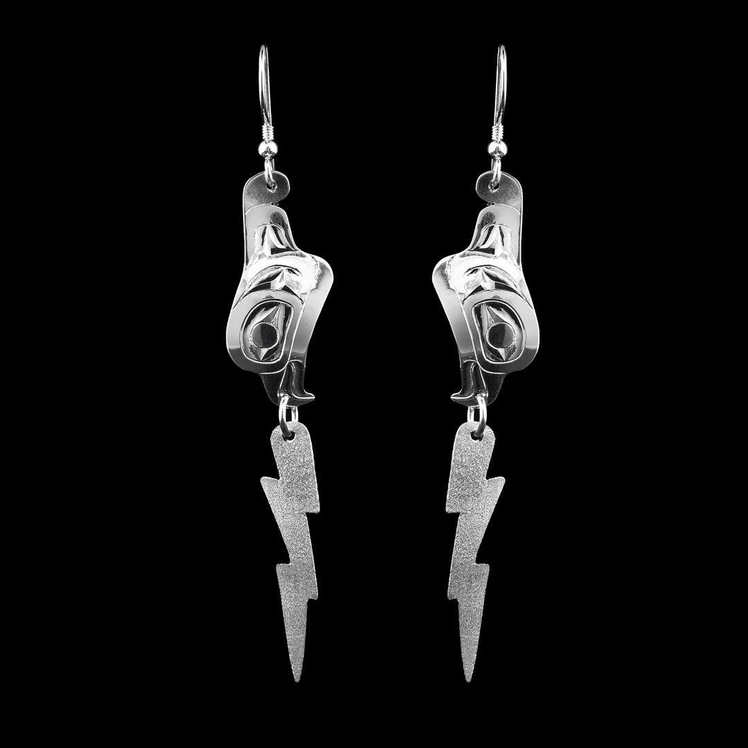Sterling Silver Thunderbird Dangle Earrings, these sterling silver dangle earrings start with the head of the thunderbird and underneath hangs a bolt of lightning.