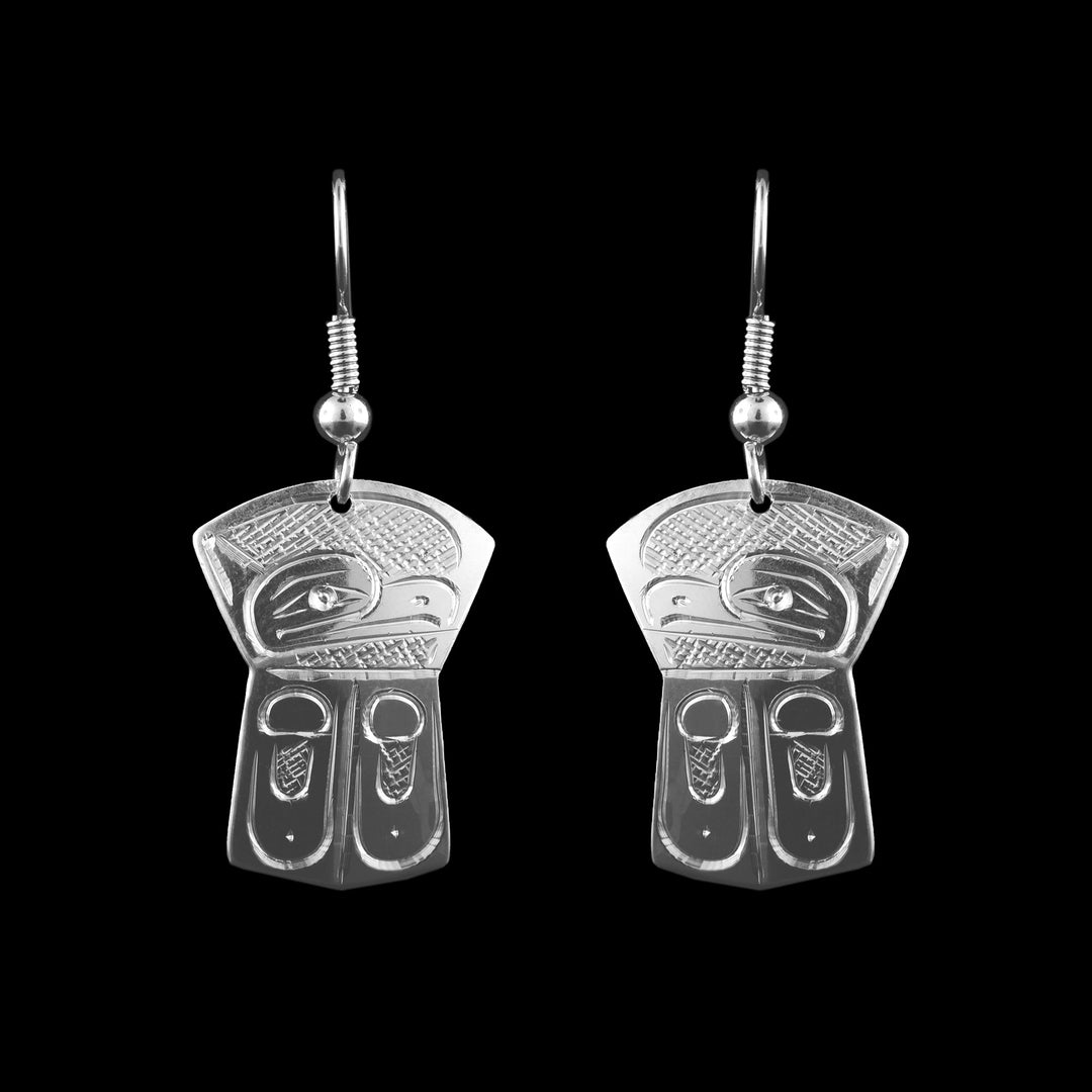 These sterling silver copper shield shaped earrings are hand carved with the legend of the Thunderbird on them.