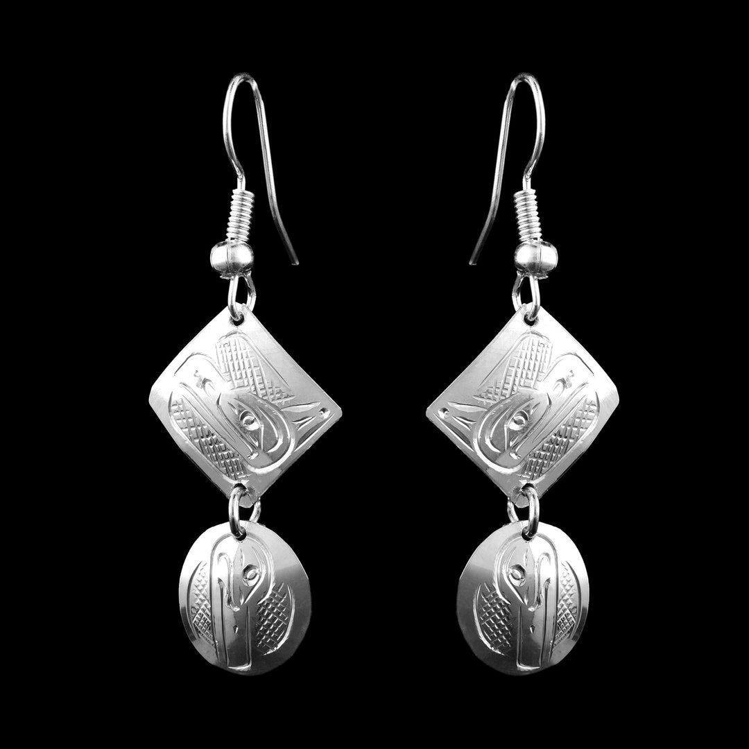 Sterling Silver Tiered Dangle Eagle and Raven Earrings. The Eagle legend is carved into the top square of the earrings and the Raven is carved into the bottom circle hanging off the square.