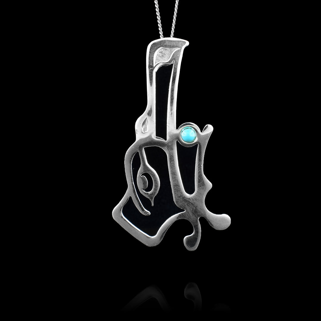 This large sterling silver Raven pendant by Haida Gwaii artist Gina Mae Schubert. Handcrafted with intricate detail, this statement piece features a genuine turquoise gemstone set in the Raven's mouth.