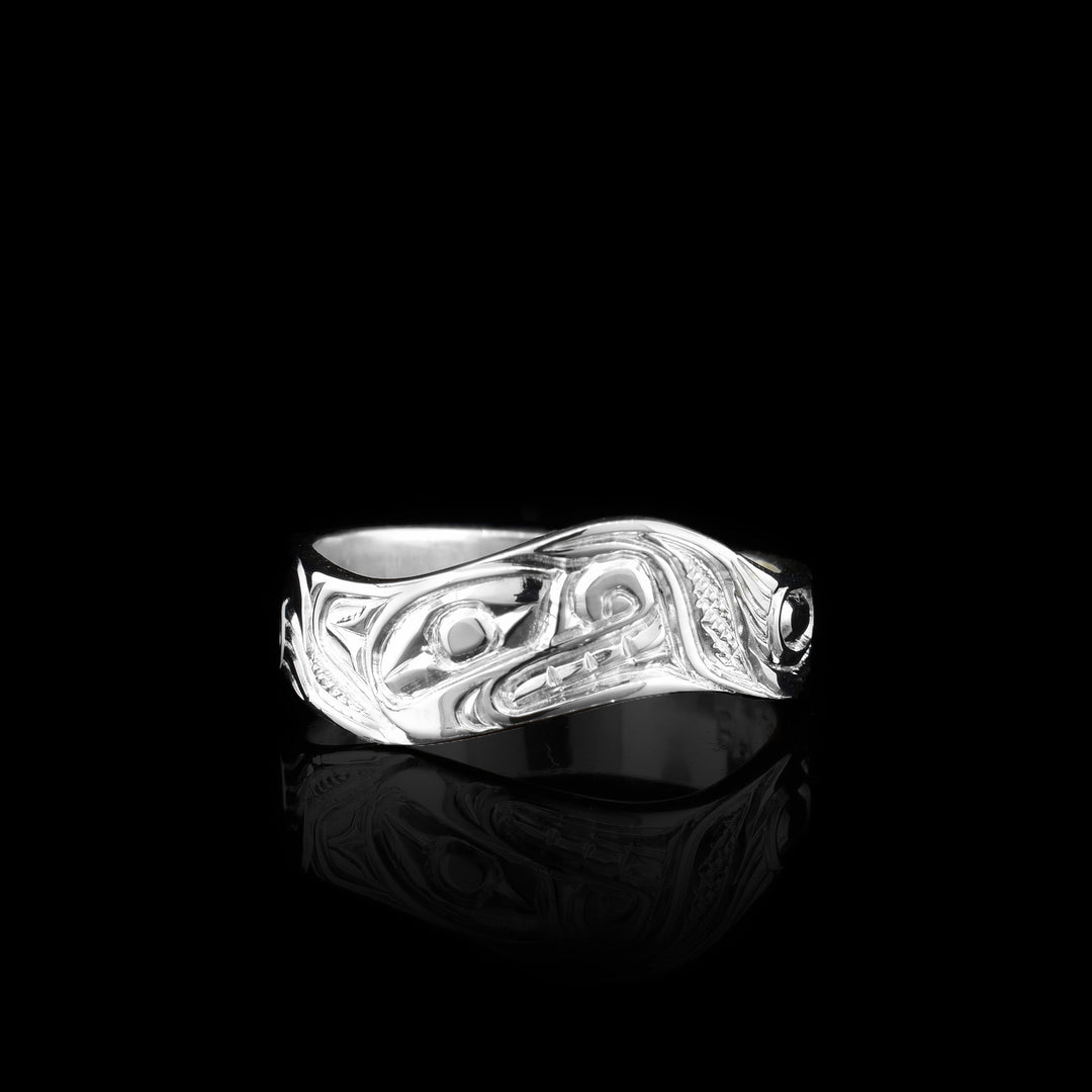 This sterling silver wavy ring band is hand carved with the symbol of the bear.