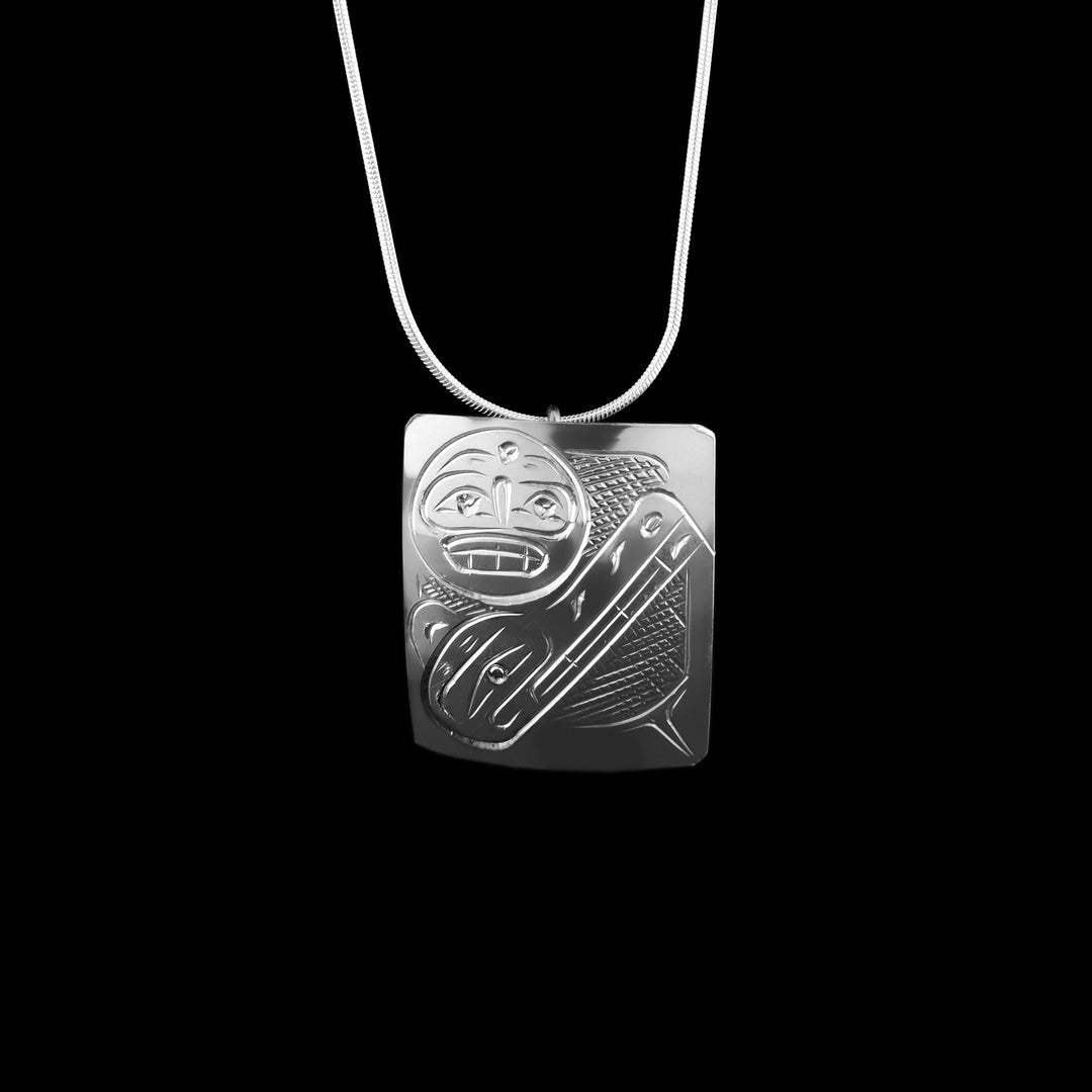 Hand-carved sterling silver Wolf and Moon pendant by Coast Salish artist Graham Henry. A square, hand-engraved pendant featuring traditional Northwest Coast legends.