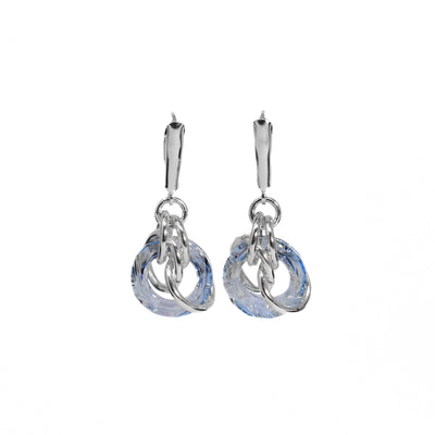 Circular blue shade Swarovski crystals with sterling silver rings woven through them hang from flange hooks.