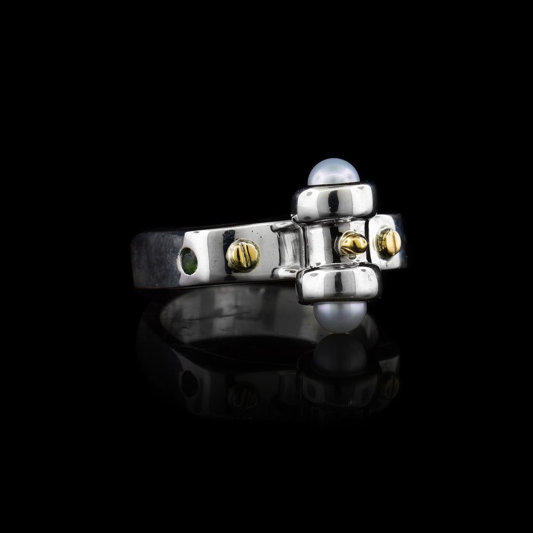 Elevate your collection with this modern architectural ring. Expertly crafted in sterling silver with yellow gold screw accents and delicate pearl settings.