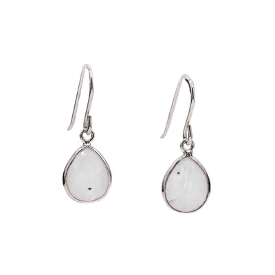 Faceted teardrop-shaped pieces of moonstone set in sterling silver hang from sterling silver hooks. By Elizabeth Burry.