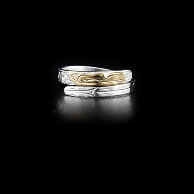 Sterling silver wrap ring with 14K yellow gold eagle head. 0.13” wide band. Hand-carved by Kwakwaka’wakw artist Victoria Harper.