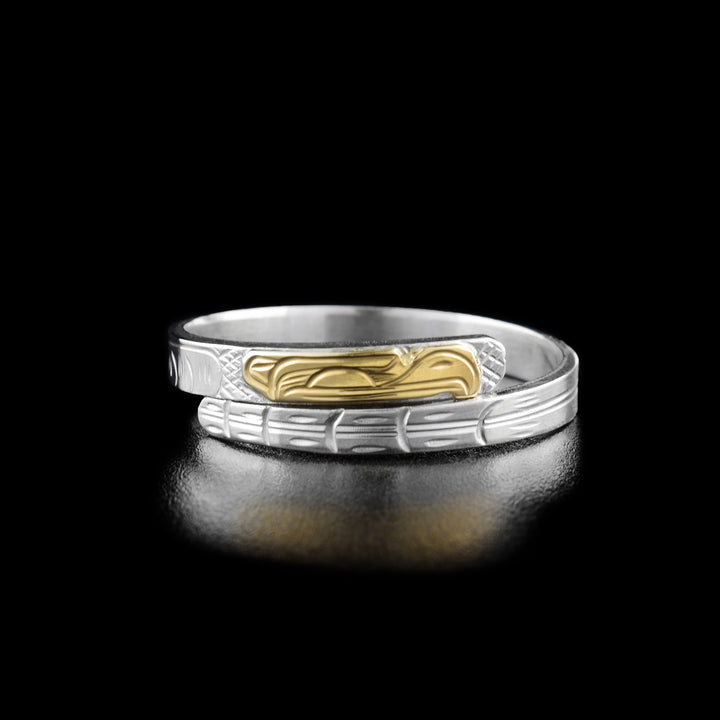 Sterling silver wrap ring with 14K yellow gold eagle head. 0.13” wide band. Hand-carved by Kwakwaka’wakw artist Victoria Harper.