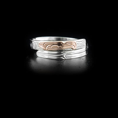 Sterling silver wrap ring with 14K rose gold eagle head. 0.13” wide band. Hand-carved by Kwakwaka’wakw artist Victoria Harper.
