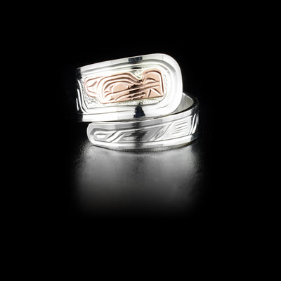 Sterling silver wrap ring with 14K rose gold wolf head. Band is 0.38” at its widest. Hand-carved by Kwakwaka’wakw artist Victoria Harper.