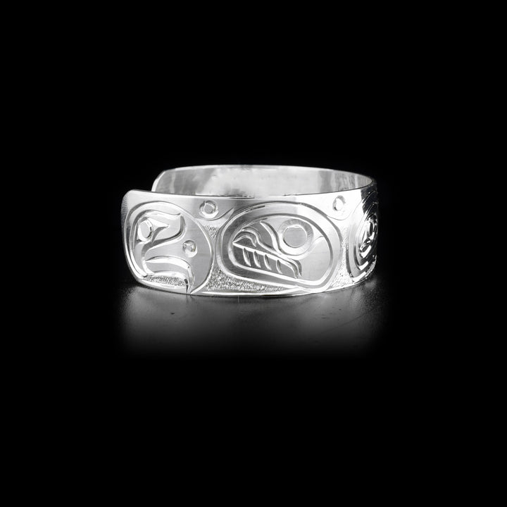 Right side of sterling silver cuff bracelet featuring orca and eagle.