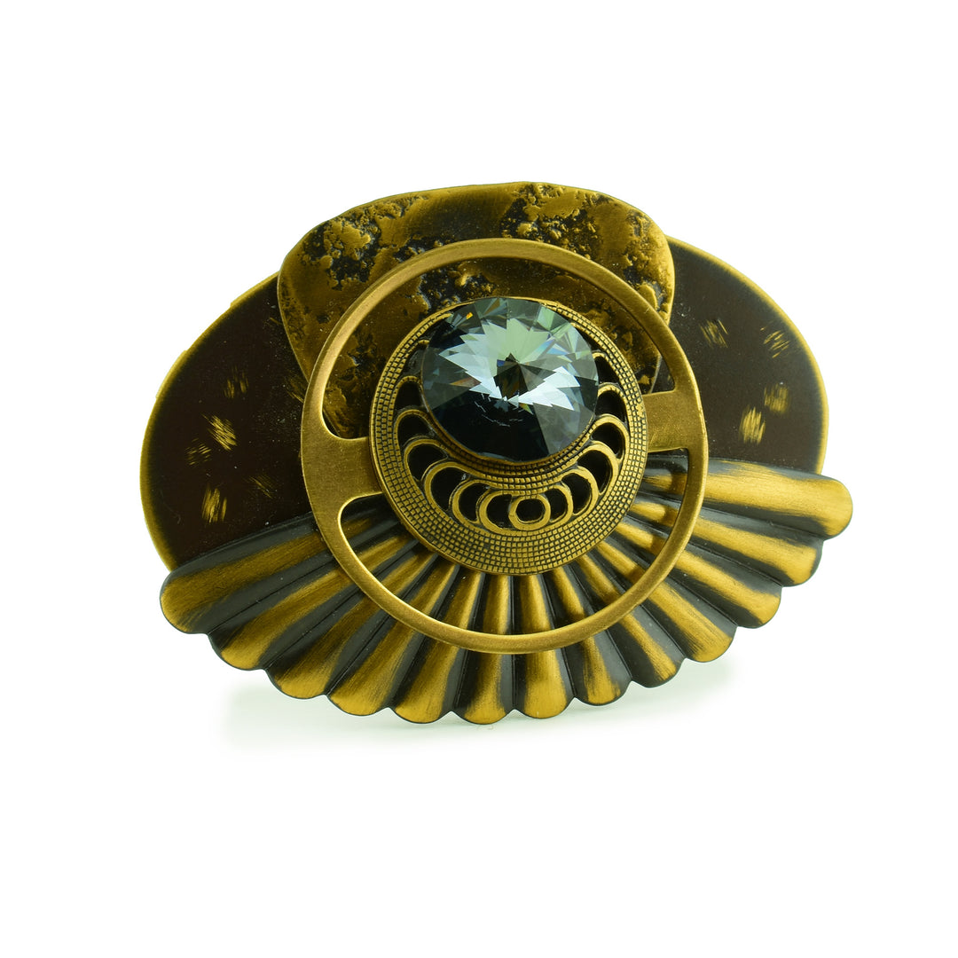 Tofino Blue Crystal Brooch - This brass brooch manipulated to match the sea life of a clam and in the middle an Austrian crystal sits in the middle.