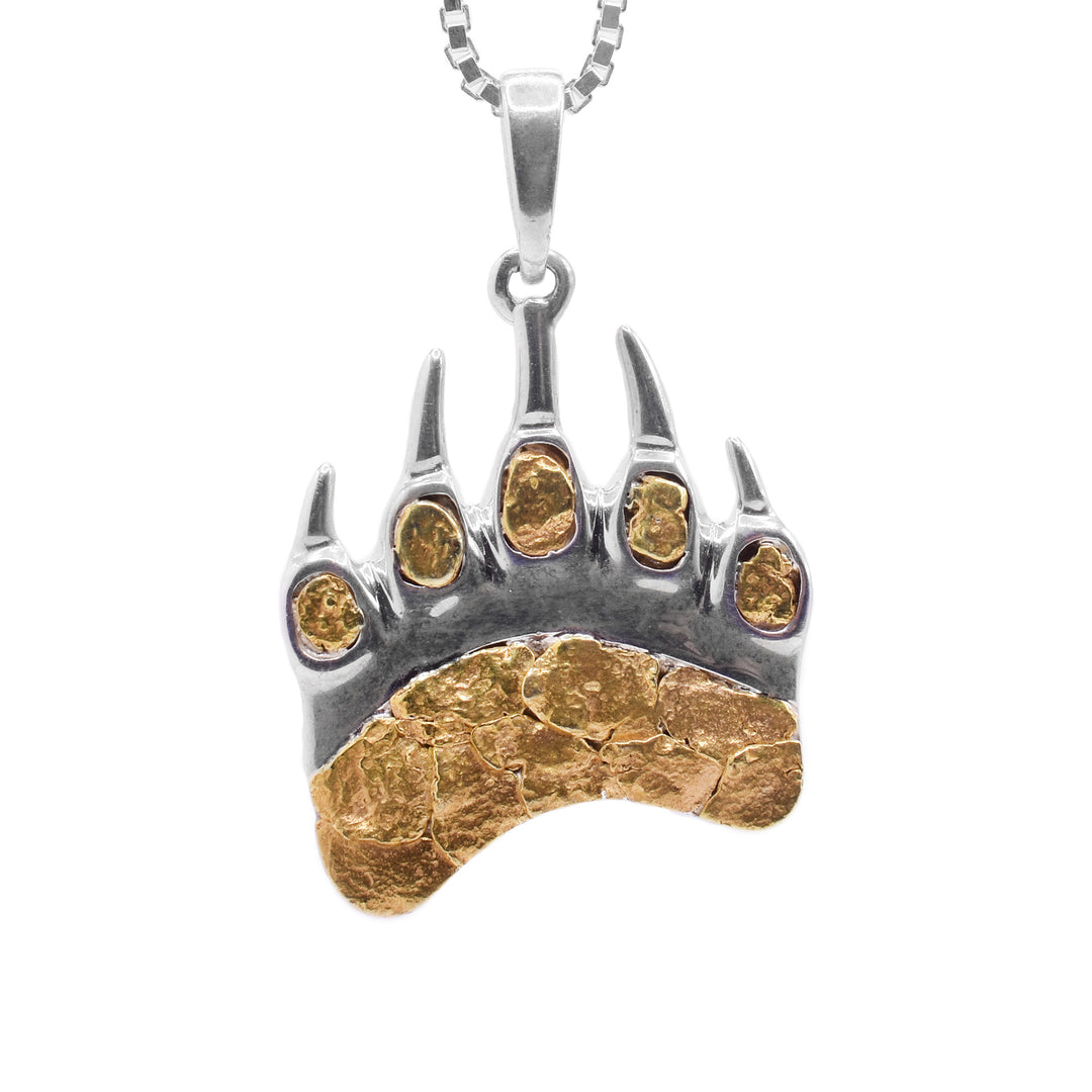 This 22K gold nugget pendant is made from sterling silver that is shaped like a bear paw with claws. The pendant is filled in the sole and the toes with gold nuggets.