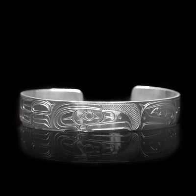 This sterling silver cuff bracelet has a depiction of the Eagle carved into the surface of the band.