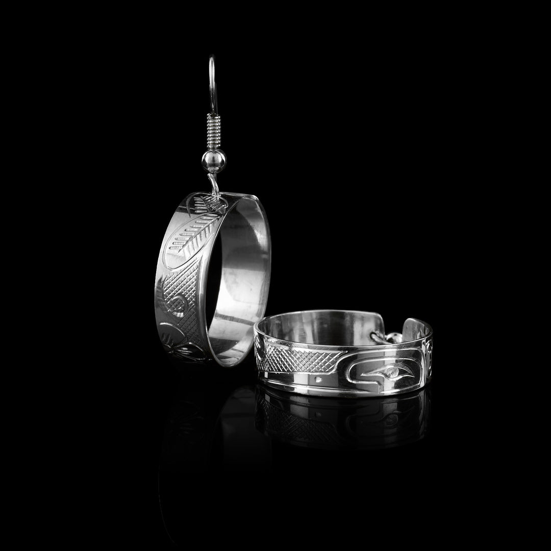 Authentic hand-carved sterling silver hummingbird hoop earrings by Travis Henry. A beautiful blend of traditional Indigenous design and modern jewelry.