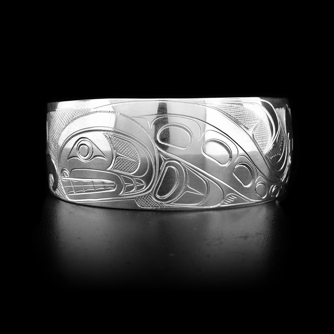 This sterling silver cuff bracelet has a wide band and there is a beautiful depiction of the Orca carved into the surface of the band. 