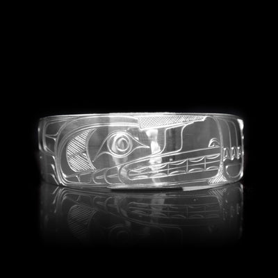 This sterling silver cuff bracelet has a wide band with a depiction of the Wolf carved into the surface of it.