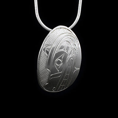 This sterling silver pendant is oval shaped and depicts the Wolf.