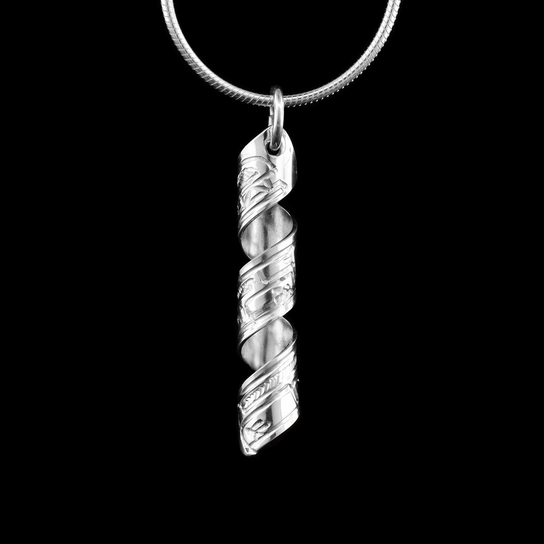 This Bear spiral pendant is made out of a sterling silver strip which has the face and body of the Bear carved on it and then coiled into a spiral.