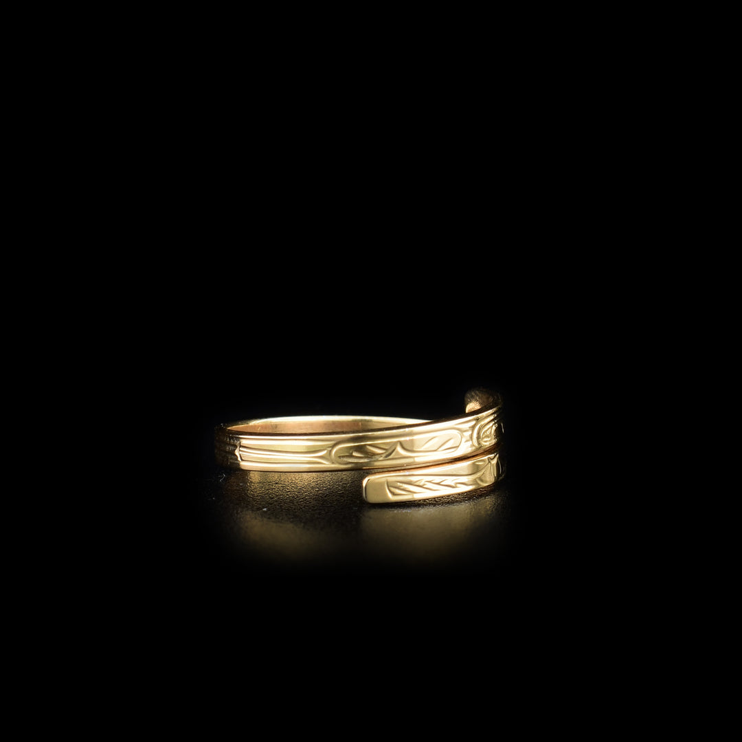 This Hummingbird ring is made from 14K gold and has a thin band that wraps around the finger twice. There is a depiction of the Hummingbird carved into the surface of the band.