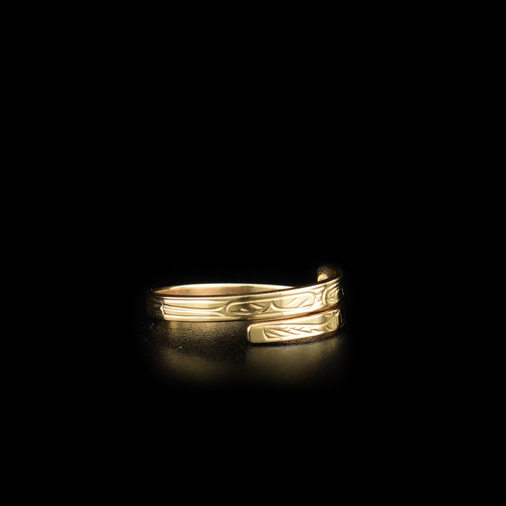 This Hummingbird ring is made from 14K gold and has a thin band that wraps around the finger twice. There is a depiction of the Hummingbird carved into the surface of the band.