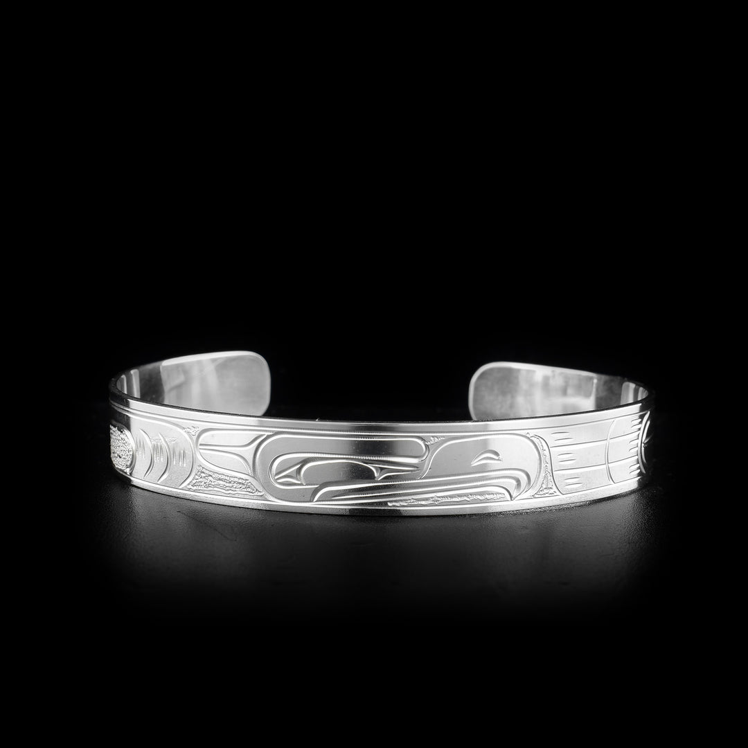 This Eagle bracelet is made from sterling silver and is a cuff bracelet. There is a depiction of the Eagle carved into the surface of the band.