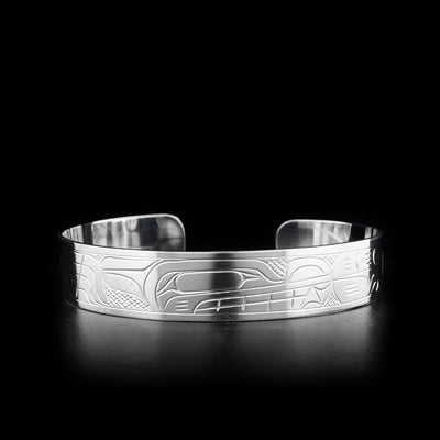 The Wolf and Moon bracelet is made from sterling silver. There are depictions of the Wolf and the Moon carved into the surface of the cuff.