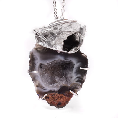 Abstract water cast sterling silver pendant featuring an Ochoco agate geode. Sterling silver chain included. By Johanne Rousseau.