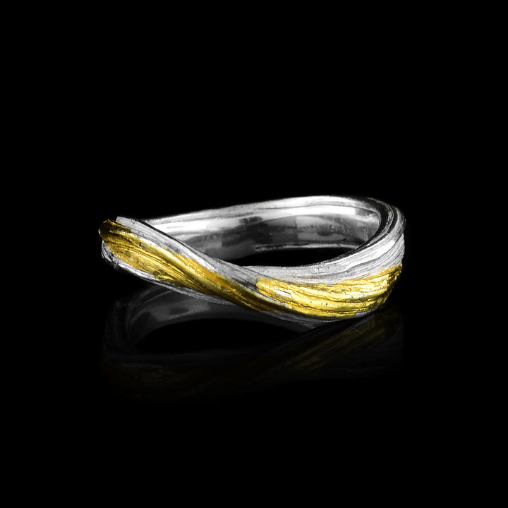 this handcrafted Keum-boo ring by Lisa-Marie Masse. Featuring textured sterling silver fused with 24k gold, this organic wave band is a wearable work of art.