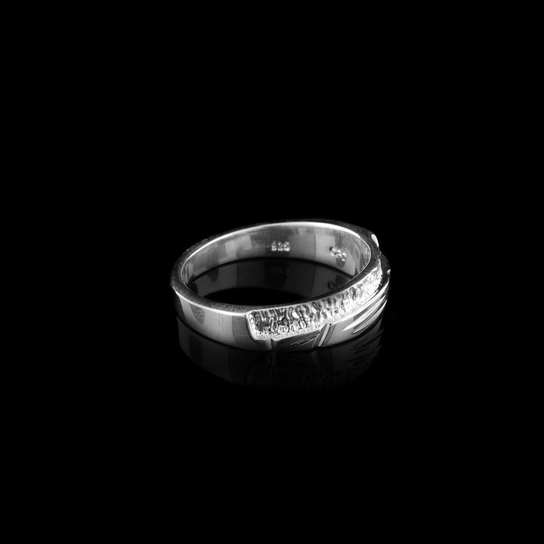 Side-view of whimsical abstract sterling silver ring.
