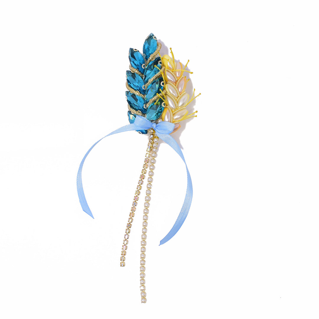 Dazzling brooch made using light blue ribbon, light blue crystal and faux pearl beads. By Ukrainian guest artist Zarmilka.
