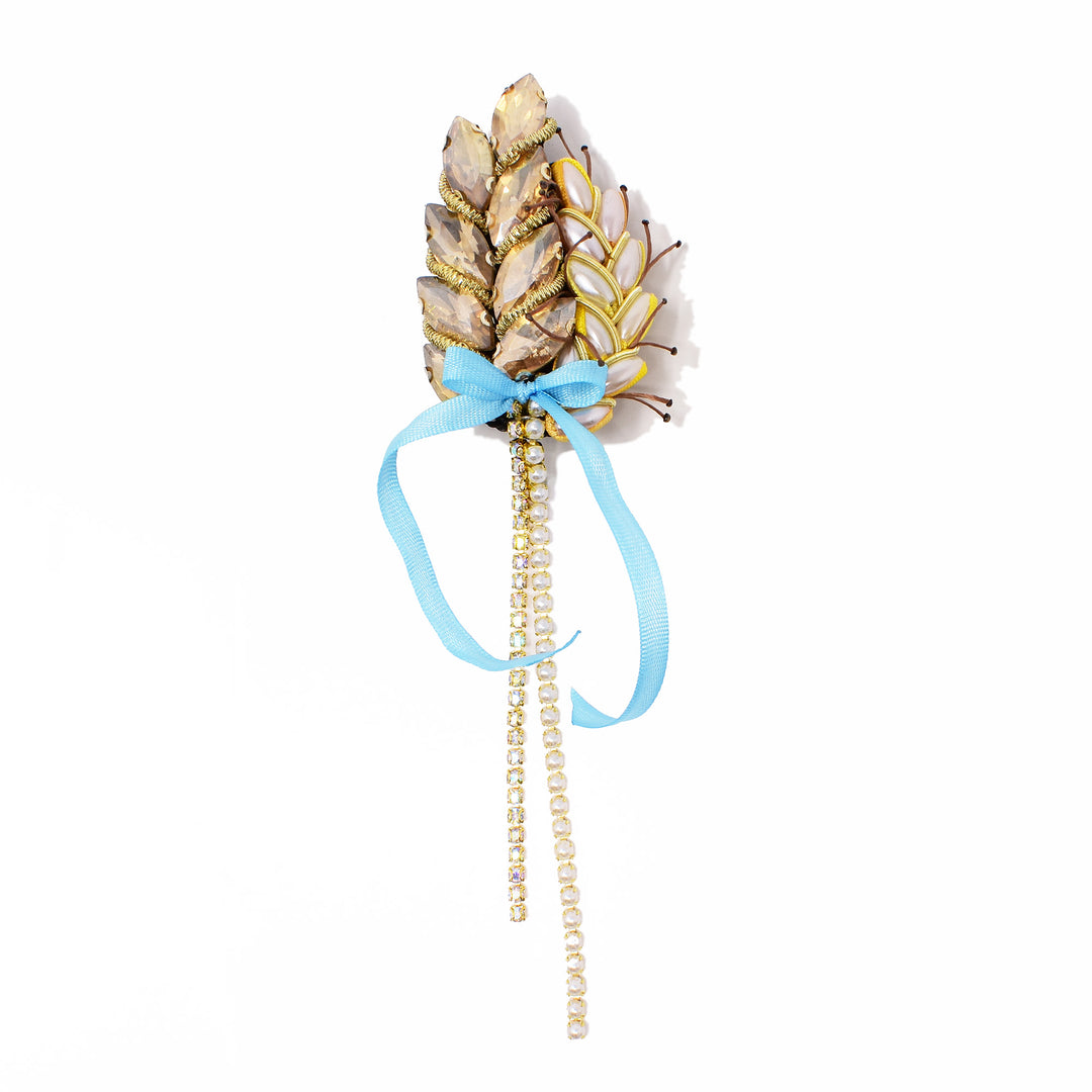 Dazzling brooch made using light blue ribbon, gold crystal and faux pearl beads. By Ukrainian guest artist Zarmilka.