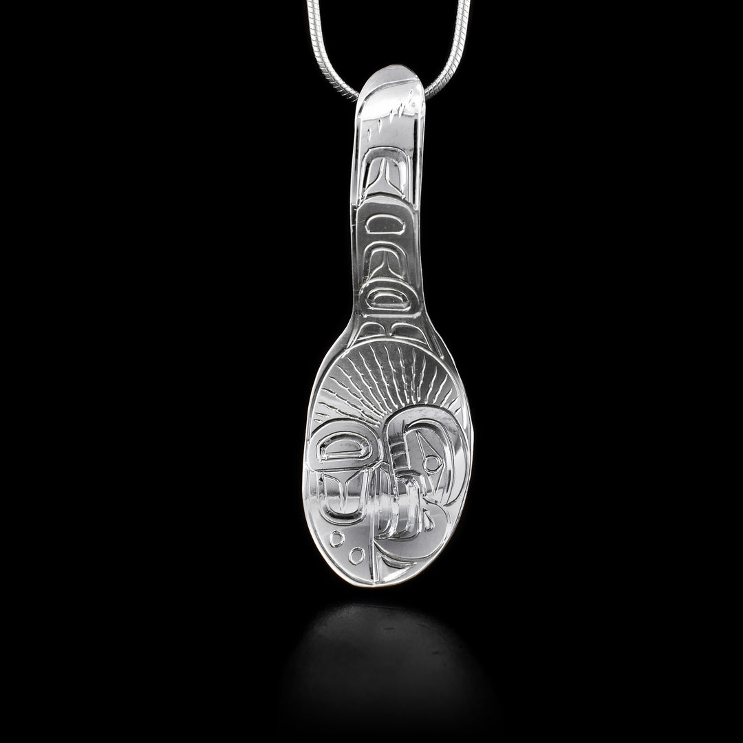 This sterling silver Eagle pendant is shaped like a spoon and is attached by the end of the spoon's handle. There are also engravings that depict the Eagle on it.