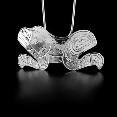 This sterling silver pendant is shaped like the Frog and has patterns carved into it to depict the Frog