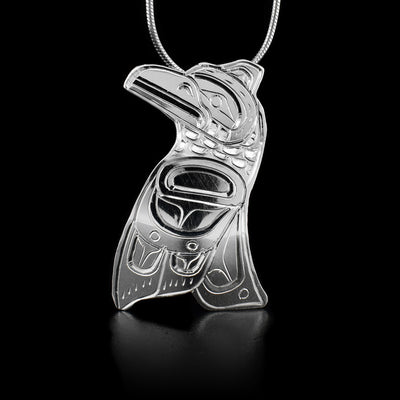 This sterling silver pendant is shaped like the Raven and has engravings that depict the Raven.